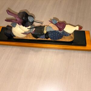 Williraye studio ceramic snowman on a sled